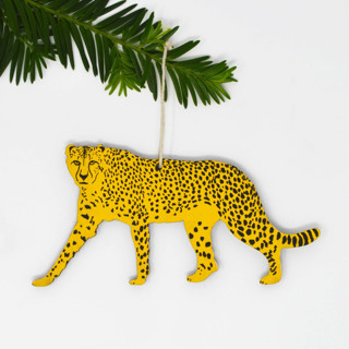 This is a yellow holiday decorations by Broderpress called wooden silkscreen cheetah ornament in standard