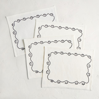 This is a cream table linens by Inkblot Design called all grown up in standard