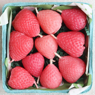 This is a pink party decorations by Happy Organics called pink strawberry birthday beeswax candles in standard