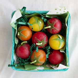 This is a multicolorassorted-colors party decorations by Happy Organics called cherry tomato beeswax birthday candles in standard