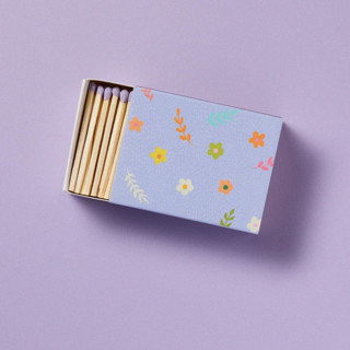 This is a purple party favors by Summer Hedglin called lavender blossom matchbox with colorful matchsticks in standard