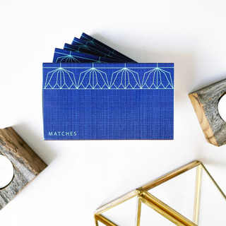 This is a blue party favors by Jessica Cunningham called lotus blossom large candle matchbox in standard