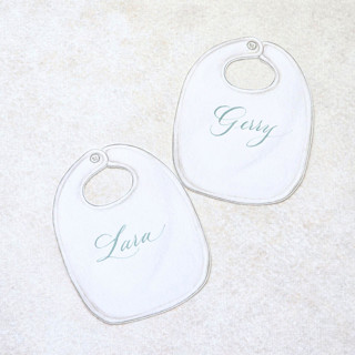 This is a white party decorations by Inkspiringletters called watercolor bib place cards-personalized set of 10 in standard