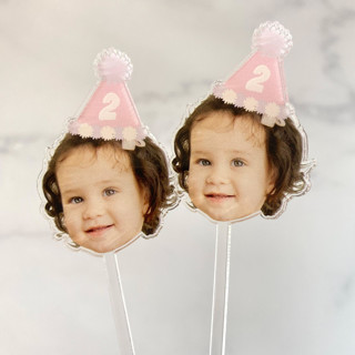 This is a clear party decorations by Atomic Kraftworks called photo stir sticks with hat in standard