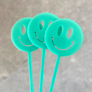 This is a multicolorassorted-colors party decorations by Atomic Kraftworks called smiley face stir sticks in standard