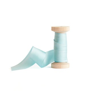 This is a baby blue wedding ribbon by Minted called 1" blue silk in standard