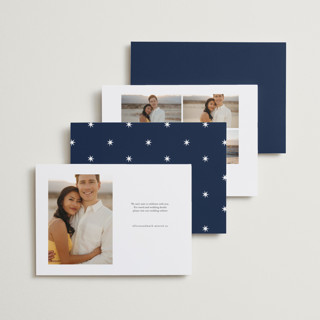 This is a navy foil stamped save the date cards with foil pressed by Andrea Cernin called minimal elegance printing on recycled smooth signature in standard