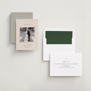 This is a champagne foil stamped save the date cards with foil pressed by Paper Raven Co. called little heart printing on recycled smooth signature in standard