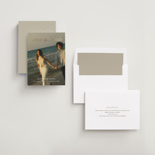 This is a ivory foil stamped save the date cards with foil pressed by Stephanie Heinrich Godbout called forever kiss printing on recycled smooth signature in standard