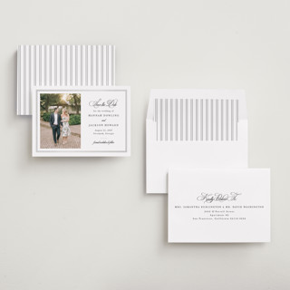 This is a snow foil stamped save the date cards with foil pressed by Sarah Brown called traditionally printing on recycled smooth signature in standard