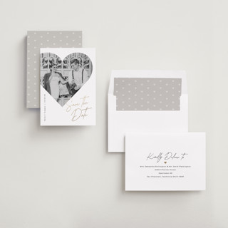 This is a snow foil stamped save the date cards with foil pressed by Sarah Curry called hearted printing on recycled smooth signature in standard