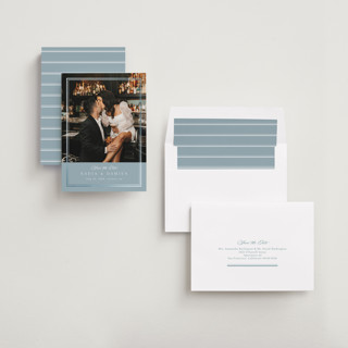 This is a slate blue foil stamped save the date cards with foil pressed by Nicole Walsh called shimmer printing on recycled smooth signature in standard