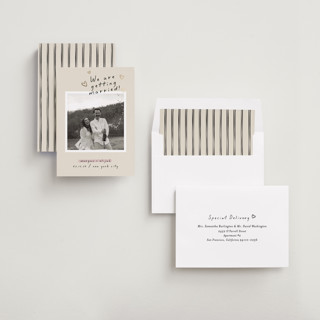 This is a nero foil stamped save the date cards with foil pressed by Pati Cascino called surprise! printing on recycled smooth signature in standard