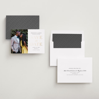 This is a gold giltz foil stamped save the date cards with foil pressed by Stacey Meacham called simply striking printing on recycled smooth signature in standard