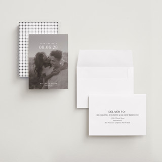 This is a moonstone petite save the dates with standard by Lucrecia Caporale called classic big date printing on recycled smooth signature in petite