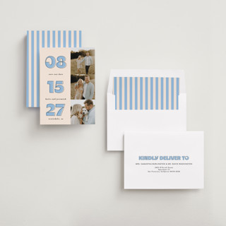 This is a dusty blue save the date with standard by Leah Ragain called outlined date printing on recycled smooth signature in standard