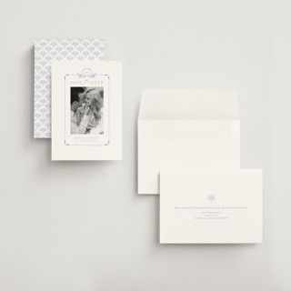 This is a pale cerulean save the date with standard by Sabrin Deirani called ocean dreams printing on recycled smooth signature in grand