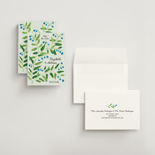 This is a mint save the date with standard by Studio Suku called lily of the valley printing on signature in grand