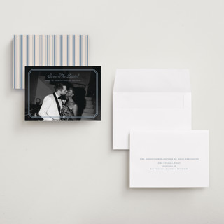 This is a french blue save the date with standard by Carolyn MacLaren called bevel monogram printing on recycled smooth signature in grand