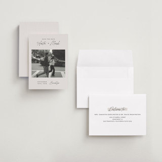 This is a eggshell save the date with standard by Paper Raven Co. called moment in time printing on recycled smooth signature in grand