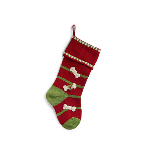 This is a red holiday decorations by Melange Collection called dog bone stocking - red in standard