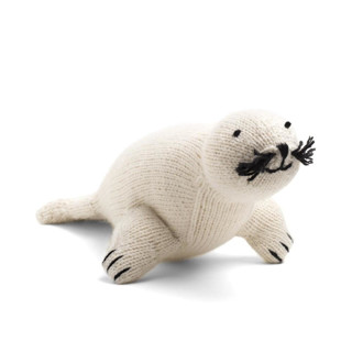 This is a white accent pieces by Global Goods Partners called knit seal toy in standard