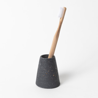 This is a black accent pieces by Pretti.Cool called black terrazzo toothbrush holder in standard