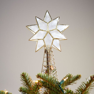 This is a white holiday decorations by Aahlada Chennupati called small gold capiz shell star tree topper in standard