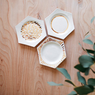 This is a green decorative objects by Bridget Dorr called set of 3 gold luster honeycomb dishes in standard