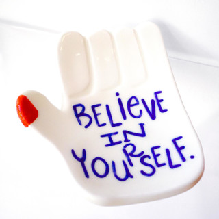 This is a white decorative objects by Carrie ONeal called believe in yourself ceramic tray in standard