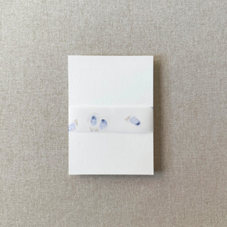 This is a blue belly bands by Cotton and Bow called oysters watercolor vellum belly band | for 5x7" invitations | set of 10 in standard
