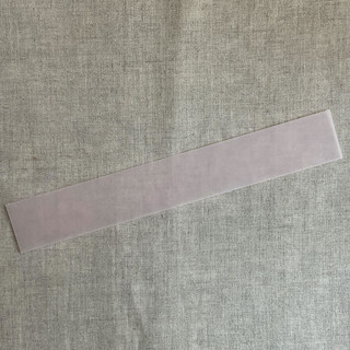 This is a pink belly bands by Ivory Invitations called blush colored translucent vellum belly band for 5x7 inch invitation | pack of 10 in standard