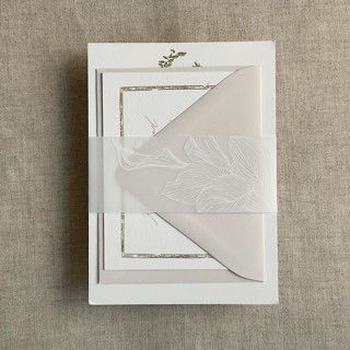 This is a white belly bands by Ivory Invitations called calla lily white ink printed vellum belly band for 5x7 card style a | pack of 10 in standard