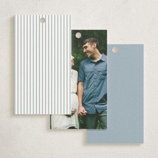 This is a dusty blue baby shower favor tags with standard by Stacey Meacham called storybook stork printing on signature in tag