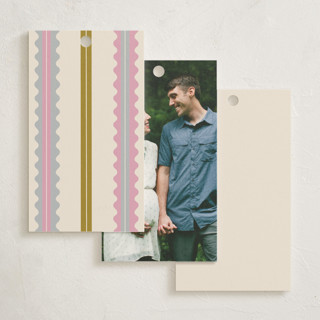 This is a vanilla baby shower favor tags with standard by Pixel and Hank called swiggle printing on signature in tag