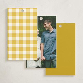 This is a mustard baby shower favor tags with standard by Jamie Alexander called baby-q printing on signature in tag