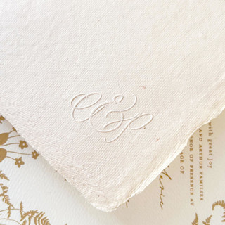 This is a black wedding stationery by Cedar and Grey called custom monogram embosser no. 8 in standard