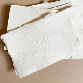 This is a silver wedding stationery by Jenny Sanders called holiday holly branch embosser in standard