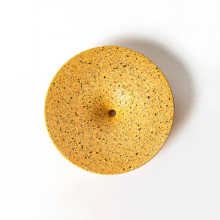 This is a yellow accent pieces by Pretti.Cool called marigold terrazzo dimple wall hook, medium in standard