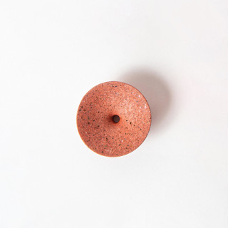 This is a red accent pieces by Pretti.Cool called coral terrazzo dimple wall hook, small in standard