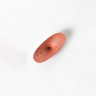 This is a red accent pieces by Pretti.Cool called coral terrazzo dimple coat hook in standard
