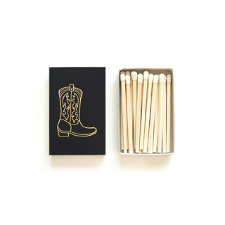 This is a brown matchbooks by Jessica Cunningham called cowboy boot matchbox | gold on chocolate brown in standard
