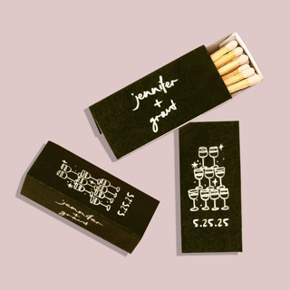 This is a black matchbooks by ForYourParty called kitschy cocktail hour toasting glasses triangle matchbox, set of 100 in standard