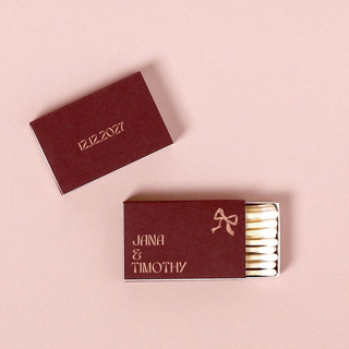This is a red matchbooks by ForYourParty called modern names and date bow matchbox, set of 100 in standard