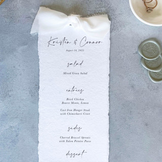 This is a white menu cards by Cotton and Bow called handmade paper menus with ivory bow | set of 10 | custom text in standard