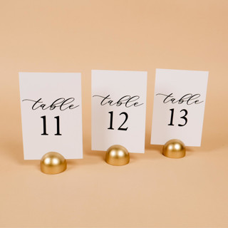 This is a white table numbers by Hanna Roberts called table number | set “11-20” | white & gold in standard