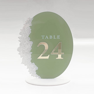 This is a clear table numbers by Artifacture called oval printed acrylic table numbers w/ gold mirror numbers in standard