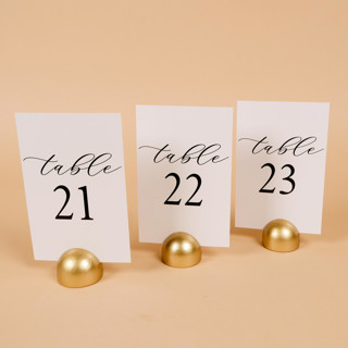 This is a white table numbers by Hanna Roberts called table number | set “21-30” | white & gold in standard