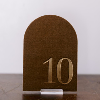 This is a gold table numbers by Velvet Raptor called table number - arch - gold in standard