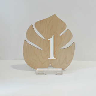 This is a natural table numbers by Alexandra Ettis called wood palm table number in standard